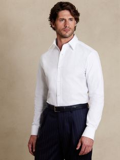 Our luxurious 120s poplin fabric is woven from 2-ply yarns which give this dress shirt added opacity and a smooth, soft feel against the skin.  True Slim Fit: Slimmer than our Tailored Slim, this cut has a close fit with darts at the back.  Spread collar.  Button front.  Shirttail hem.  True Slim Fit: Slimmer than our Tailored Slim, this cut has a close fit with darts at the back.  Long sleeves.  Hip length.  Model: Size M, 6'2" (188cm). Tie Reference, White Shirt With Tie, Casual Poses, Three Pigs, Shirt With Tie, Cotton Poplin Dress, Poplin Dress, Selling Clothes, Banana Republic Dress