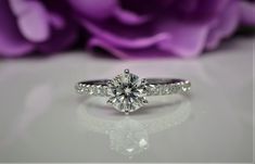 a close up view of a diamond engagement ring