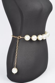 Elevate your outfit with our Iconic Pearl Station Chain Belt. Indulge in the luxury of genuine pearls and a delicate chain, adding a touch of elegance to any look. Complete your wardrobe with this timeless and sophisticated accessory. One Size Width - 1.25" Length - 50" PVC, Faux Pearl, Mix Metal Lead & Nickel Compliant Chic Evening Jewelry With Beaded Chain, Chic Beaded Chain Jewelry For Evening, Chic Adjustable Pearl Necklace, Chic Pearl Necklace With Pearl Charm, Elegant Metal Chain Belt For Gift, Elegant Gold Chain Belt Fashion Accessory, Chic Pearl White Necklace With Pearl Charm, Trendy Pearl Necklace With Beaded Chain, Chic Pearl White Pearl Necklace For Party