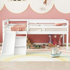 a child's bedroom with pink walls and white bunk beds, toys on the floor