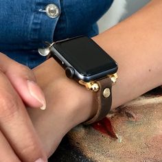 High Quality Slim Brown Color Leather Strap with Gold Accents. Women Style Classy Strap with Adjustable Buckle. Gorgeous Design Bracelet Tailored to Perfection. Designed And Handmade by Simeon D Jewelry Studio. This Bracelet Fits ALL Apple Watch Series. Please Measure Your Wrist Before Submitting Your Order! Not For Other Models. Apple Watch Is NOT Included. Let's be Friends! Follow my Studio on Social Media Instagram @simeondjewelry Pinterest @simeondjewelry Facebook @simeondjewelrystudio Gold Leather Strap Watch Band For Everyday, Gold Watch Band With Leather Strap For Everyday, Adjustable Leather Strap Watch Accessories, Everyday Gold Watch Band With Leather Strap, Adjustable Round Gold Watch Bands, Adjustable Gold Round Watch Bands, Gold Leather Strap Apple Watch Band Gift, Gold Apple Watch Band With Leather Strap As Gift, Adjustable Bracelet Strap Watch Accessories For Gift