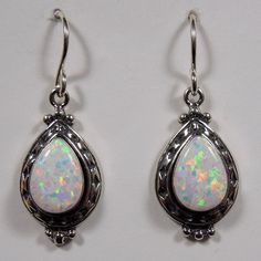 Brand New Sterling Silver Dangle Earrings With 7x10mm Pear Shape Lab Created White Fire Opal Cabachon Stones Set On Solid 925 Sterling Silver. These Earrings Are Handcrafted In The Usa. Our Silver Is Genuine 925 Sterling Silver And Stamped 925. Earrings Measures 1-1/4" Long (Including Ear Wire) And 7/16" Wide. You Will Receive The Item In A Gift Box. Classic White Sterling Silver Teardrop Earrings, Classic White Teardrop Sterling Silver Earrings, White Opal Teardrop Jewelry, White Opal Drop Earrings, White Teardrop Opal Jewelry, White Pear-shaped Teardrop Earrings, 925 Earrings, Usa Jewelry, Silver Dangle Earrings