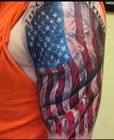 a man with an american flag and eagle tattoo on his arm