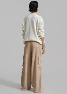 Color: Ivory Midweight wool blend fabric Oversized fit Crew neckline Padded shoulders Rib knit trim Slip on style Unlined 90% Merino Wool 10% Cashmere Hand Wash in Cold Water By The Frankie Shop. Imported Oversized Cargo Pants, Denim Suit, The Frankie Shop, Frankie Shop, Paris Woman, Cargo Style, Suede Fabric, Goat Leather, Color Ivory