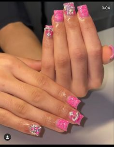 Cute Baddie Short Acrylic Nails, Y2k Aesthetic Nails Short, Pink Junk Nails Short, Pink Nails W Charms, Pink Square Nails With Charms, Pink French Tip Nails With Cross Charm, Short Nails With Charms, Short Pink Acrylic Nails With Charms