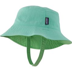 We plop the Patagonia Baby Sun Bucket Hat on our little one's head to get them ready for sun-filled adventures. This reversible hat has a full-wrap brim for total sun protection and a chin strap with hook-and-loop closure to keep it on our little one's head. Green Sun Hat With Upf 50+ And Adjustable Fit, Green Adjustable Sun Hat With Uv Protection, Green Sun Hat With Uv Protection And Adjustable Fit, Green Sun Hat For Summer Camping, Green Summer Hats For Playtime, Green Reversible Sun Hat With Curved Brim, Green Adjustable Fit Bucket Sun Hat, Adjustable Fit Green Brimmed Sun Hat, Green Summer Playtime Hats