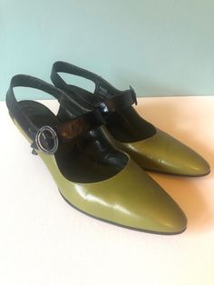 "AMALFI Vintage Black And Green Slingback Designer Shoes, 1960's  Made In Florence Italy, Rangoni. Size 6 1/2 AA Approx 2 1/2\" heel Condition- Shoes have been gently used. The colors are amazing.  ~ If purchasing more than one item CONVO me regarding shipping costs ~" Retro Ankle Strap Heels For Formal Occasions, Retro Leather Slingback Heels, Vintage Slingback Pumps For Spring Formal, Retro Green Heels For Evening, Retro Formal Slingback Pumps With Pointed Toe, Vintage Pointed Toe Slingback Pumps With Heel Strap, Vintage Slingback Pumps For Spring, Vintage Green Heels For Formal Occasion, Vintage High Heel Slingback Pumps For Evening