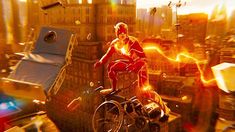 a man riding a bike in the middle of a city with buildings and fire coming out of his mouth