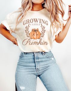 Celebrate the beauty of autumn and your pregnancy with this stylish fall-themed shirt! ORDERING INFO  ALL ITEMS ARE SOLD SEPARATELY  HOW TO:  1. Choose the SHIRT COLOR from the 1st dropdown. 2. Choose the SHIRT SIZE from the 2nd dropdown. 3. Add each item to the cart.  💥If you are purchasing more than one item, complete this process as many times as needed.  VERY IMPORTANT 💥 SIZING AND FABRIC INFO: -- Unisex Shirt -- Sizing Info: These shirts are a unisex style meaning they tend to run wider/longer than women's styles might; however, if you are looking for the looser look, you might consider sizing up as they are true to size. Model sized up 2 sizes. Make sure to use the measurements chart to determine the best size for the fit you are looking for. (Allow for up to 1.5" laying flat varia Casual Fall Maternity Tops, Casual Maternity Tops For Fall, Fall Pregnancy, Fall Pregnancy Announcement, Funny Pregnancy, Fall Maternity, Pregnancy Announcement Shirt, Pregnancy Humor, Pregnancy Reveal