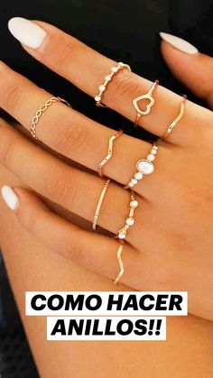 a woman's hand with five different rings on it and the caption reads, gold ring & minimalist stackable rings