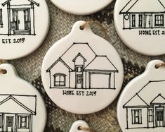 four ceramic ornament with houses drawn on them