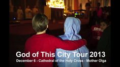 a young boy in a red jacket is holding onto another person's back with the words god of this city tour 2013