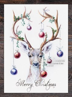 a watercolor painting of a deer with ornaments hanging from it's antlers