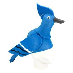 a blue bird is sitting on top of a white mannequin's head