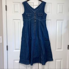 Nwt American Dynasty Women’s Medium Wash Denim Sleeveless Dress. Size Medium. Has Pockets. Tie In Back. Two Chest Pockets Are Non-Functional. 100% Cotton. Made In Jordan. Zoom In On All Photos. Questions Welcomed. Colors May Vary. Photos Taken With An Iphone. All Sales Final. Sleeveless Dark Wash Dress With Buttons, Sleeveless Dark Wash Denim Dress With Buttons, Sleeveless Dark Wash Vintage Denim Dress, Vintage Sleeveless Dark Wash Denim Dress, Sleeveless Vintage Denim Dress In Dark Wash, Vintage Blue Sleeveless Denim Dress, Vintage Sleeveless Denim Dress With Pockets, Sleeveless Vintage Denim Dress With Pockets, Vintage Sleeveless Denim Dress