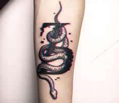 a black and red tattoo on the arm of a person with a snake in it