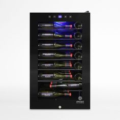 This sleek black wine cellar features a precision refrigeration system that maintains an optimal temperature-controlled environment to bring out the full flavor of red or white wines. Touch-screen controls make it easy to adjust the temperature from 41 to 68 degrees, and the tinted glass door locks with a key. Its slim design has a small footprint and recessed handle for a clean, modern look. With sturdy grooved wire racks that cradle bottles and an open storage area below, the wine refrigerator Tinted Glass Door, Recessed Handle, Glass Door Lock, Groove Metal, White Wines, Wine Tools, Wine Refrigerator, Tinted Glass, Wire Racks