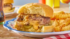 a hamburger and french fries on a plate