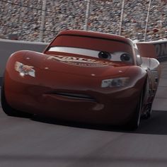 the character from cars is driving around a track