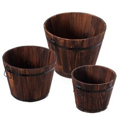 three wooden buckets sitting next to each other