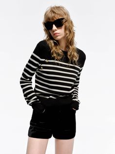 MO&Co. Women's Wool Striped Knit Sweater This sweater is made from soft and delicate Merino wool, the classic black and white striped sweater features vintage-inspired metal buttons and can be dressed up or down. Perfect for everyday elegance and romantic rendezvous. Features : - Regular fit, crewneck design- Classic black and white stripes, vintage metal button- Ribbed knit details on cuffs and the bottom Code: MBD1SWT012The back length of size S is 54.5cmMATERIALS & CARE Material: 100% WoolPle Elegant Striped Winter Sweater, Elegant Striped Sweater For Spring, Classic Striped Sweater For Work, Striped Sweater With Button Closure For Work, Striped Knit Sweater, White Striped Sweater, Everyday Elegance, Crewneck Design, Mesh Bag