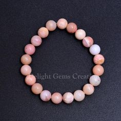 Product Details : Item Code : DGC1100Gemstone Name :  Pink OpalChain Style : BeadedBeads Shape : Smooth Round Beads Size : 10 MM  ApproxLength : 8"Inch/  StretchableWeight : 115 Cts. ApproxCustomization : **Available**Please Feel Free To Contact If You Have Any Query. Pink Opal Beaded Bracelets With Round Beads As Gift, Pink Opal Beaded Bracelets As Gift, Pink Opal Round Beads Jewelry, Pink Bracelets With 8mm Round Beads, Pink Opal Bracelets As Gifts, Pink Stretch Bracelet With Gemstone Beads, Pink Polished Beads Bracelet, Pink Polished Beaded Bracelets, Pink Round Bracelets With Polished Beads