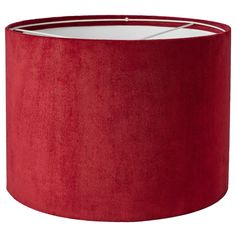 a red lampshade with a white light in the middle and a round shade on top