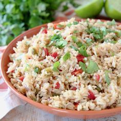 a bowl filled with rice and garnished with cilantro