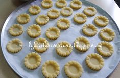 small pies are arranged on a cookie sheet