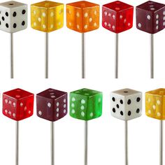 several dice shaped lollipops are shown in different colors