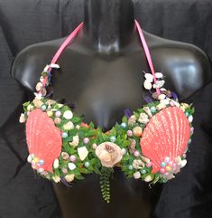 Deluxe Mermaid glamour bra SZ 12 UK size Pink padded bikini top Real scallop shells pink with shimmering effect  Decorated with hand gathered shells, and coral from around the world Set among an underwater world themed background  Net detail on halter neck ties  Trimmed by faux sea vegetation Heat bonded and sealed for safety  Look stunning in one of our Unique Deluxe themed bras The UKs best custom bras online shop  NEW WITH TAGS  other sizes can be made on request you want it ...we can make it Shell Bra, Custom Bras, Coquille Saint Jacques, Natural Coral, Scallop Shells, Neck Ties, Bra Top, Bra Tops, Halter Neck