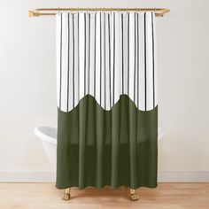 a green and white shower curtain hanging on a wall next to a bathtub in a bathroom