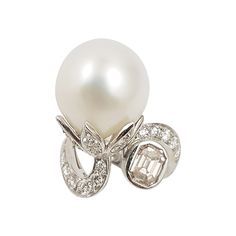 South Sea Pearl, Brown Diamond 0.83 carat with Diamond 1.12 carats Ring set in 18 Karat White Gold Settings Width: 1.5 cm Length: 2.5 cm Ring Size: 53 Total Weight: 11.64 grams "We first opened doors in 1980 when it was then situated in the vicinity of the Victory Monument; a small and modest storefront with a couple of counters. From its humble beginnings to where it stands today, our company has proven its abilities as a jeweler. Since the beginning, we have been supplying fine quality pieces Diamond Ring Set, Diamond Ring Settings, Sea Pearl, Bracelet Design, South Seas, Brown Diamond, South Sea Pearls, Sea Pearls, White Gold Rings