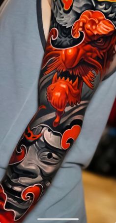 a man with a dragon tattoo on his arm