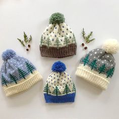 four knitted hats with different colors and designs on the top one is blue, grey, white and green