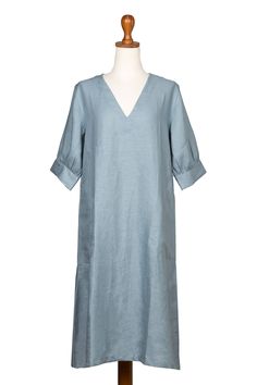 This beautiful linen garment will be a sweet addition to your wardrobe. Designed by Balinese artisan Endah, this tunic dress features a V-neckline and a solid pastel blue tone. The puffed sleeves add a warm touch, making a garment that complements many styles. Endah is always designing gorgeous creations that show the world her love for fashion. V-neck Linen Dress For Spring Daywear, Relaxed Fit V-neck Linen Dress, Relaxed Fit V-neck Linen Dress For Daywear, Relaxed Fit Linen V-neck Dress For Daywear, Spring V-neck Linen Dress, Bohemian V-neck Linen Dress For Daywear, Linen Tunic Dress, Buy Linen, Blue Tone