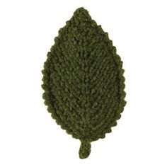 a knitted green leaf is shown on a white background, it looks like the shape of a tree