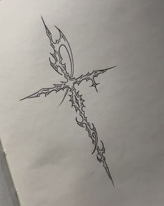 a drawing of a cross that has been drawn on paper