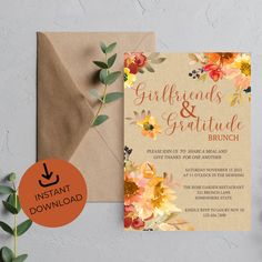 an orange and yellow floral wedding suite on top of a brown envelope with the words, girlfriendss & gruture brunch