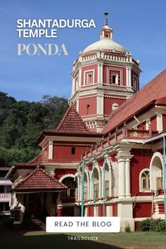 a red and white building with the words shanatadurga temple ponda