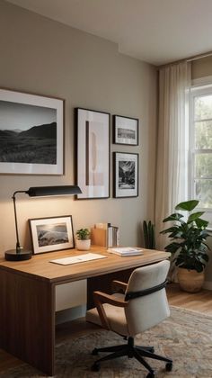 a home office with pictures on the wall and a desk in front of a window