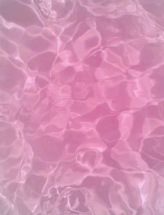 the water is very clear and pink with some ripples on it's surface