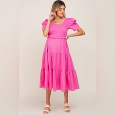 A Solid Hued Midi Dress Featuring A Smocked Top, Shirt Off Sleeves, A Tiered Skirt, A Self-Tie Open Back And A Rounded Neckline. &Merci By Pinkblush New Without Tags Small Inventory #P6590 Medium Inventory #P6589 Large Inventory #P6505 Pink Puff Sleeve Smocked Dress For Spring, Pink Smocked Puff Sleeve Dress For Spring, Pink Smocked Dress With Puff Sleeves For Spring, Pink Smocked Ruffle Hem Dress For Day Out, Summer Pink Smocked Dress With Ruffled Sleeves, Pink Smocked Dress With Ruffle Hem For Day Out, Pink Flowy Dress With Smocked Cuffs, Spring Smocked Dress With Gathered Sleeves And Tiered Shape, Feminine Smocked Dress With Gathered Sleeves For Brunch