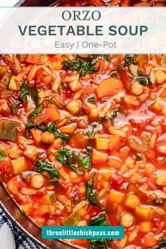 a pot filled with vegetable soup on top of a table