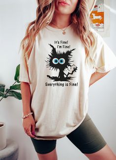 "It's Fine I'm Fine Everything Is Fine Shirt, I'm Fine Shirt, Cat Tee, Sarcasm Shirt, Gift for Funny Friends, Positivity Shirt, Mental Shirt 🌺 How To Order 🌺 1-) Please, check and review all the photos. 2-) Choose your t-shirt size and color. 3-) Click add to cart. You can go back to add more shirts. 4-)Click \"Proceed to check out\". 5-)When you check out, you can add a note to seller for any request. 🌺Unisex Shirts🌺 🌻 Unisex t shirt fits like a well-loved favorite, featuring a crew neck, short sleeves and designed with superior airlume combed and ring-spun cotton that acts as the best blank canvas for printing. 🌺Youth Shirts 🌺 🌻 This youth tee fits like a well-loved favorite, featuring a crew neck, short sleeves and superior airlume combed and ring-spun cotton that acts as a blan Sarcasm Shirts, Funny Friends, Positive Shirt, I'm Fine, Cute Black Cats, Cat Tee, Everything Is Fine, Shirt Fits, Friends Funny