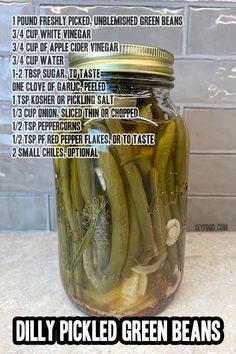 pickled green beans in a mason jar with instructions on how to put them in