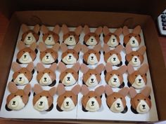 cupcakes in the shape of dogs are on display