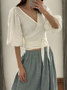 "* 100% washed linen  * 3/4 puff sleeve * The belt is attached to the blouse * Handmade in Slovakia Measurements in cm/inches:  --------------------------- Size XS / US size (4) Recommended body measurements in cm/inches: Bust: 81cm/32\" - 84 cm/33\" Waist: 65 cm/25,5\" - 68 cm/27\" Hips: 84 cm/33\" - 87 cm/34\" Length (from the neckline to the hem, measured from the back - total length): 58 cm/ 23\" --------------------------- Size S / US size (6) Recommended body measurements in cm/inches: Bust: 85/33,5\" -88/34,5\" Waist: 69/27\" - 72/28,5\" Hips: 88/34,5\" - 91/36\" Length (from the neckline to the hem, measured from the back): 58 cm/23\" --------------------------- Size S/M / US size (8) Recommended body measurements in cm/inches: Bust: 89/35\" - 92/36\" Waist: 73/28\" - 75/29,5\" Hip Fitted Linen Wrap Top, Spring Fitted Linen Wrap Top, Fitted Linen Wrap Top For Spring, Fitted Linen Blouse For Brunch, Linen Puff Sleeve Top For Brunch, Bohemian Linen Blouse For Brunch, Fitted Linen Wrap Blouse, Linen Wrap Dress, Wrap Shirt