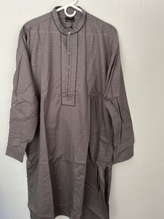 Large size Straight Kurta Elevate your look with this cotton jacquard kurta in grey with a band neckline and cuff sleeves.  Details: Band Neck, Full Sleeves With Cuff Color: dark Grey Fabric: 100% Cotton Jacquard Large chest 51" shirt length 42.5" Gray Straight Kurta For Festive Occasions, Traditional Gray Kurta For Eid, Elegant Gray Kurta For Eid, Gray Cotton Kurta For Eid, Festive Long Sleeve Gray Kurta, Formal Cotton Kurta For Eid, Classic Cotton Sherwani For Eid, Sleeves Details, Mens Kurta