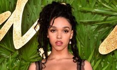 an image of a woman in black dress at the british fashion awards 2019 red carpet